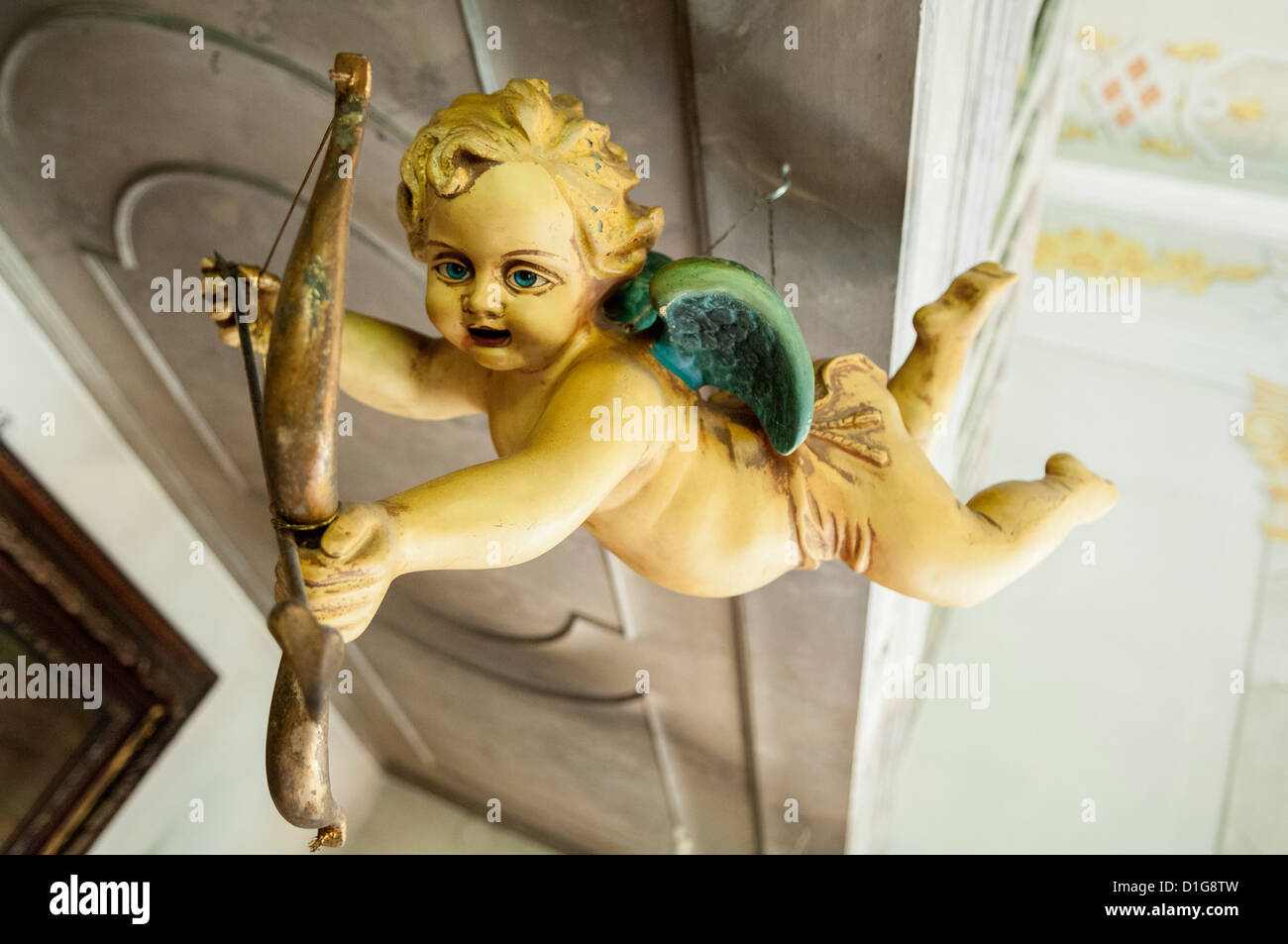 Wooden Baroque Angel with bow and arrow Stock Photo