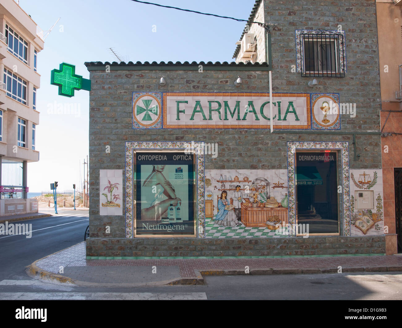 painted tile wall panels on the facade of a pharmacy in Aguilas, Murcia Spain Stock Photo
