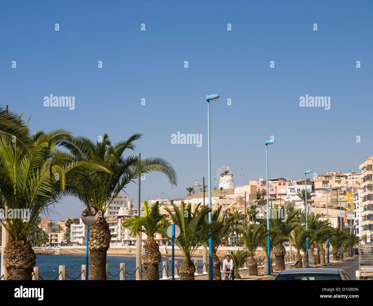 Paseo de Parra in Aguilas, Murcia Spain with palm trees windmill and beach Stock Photo