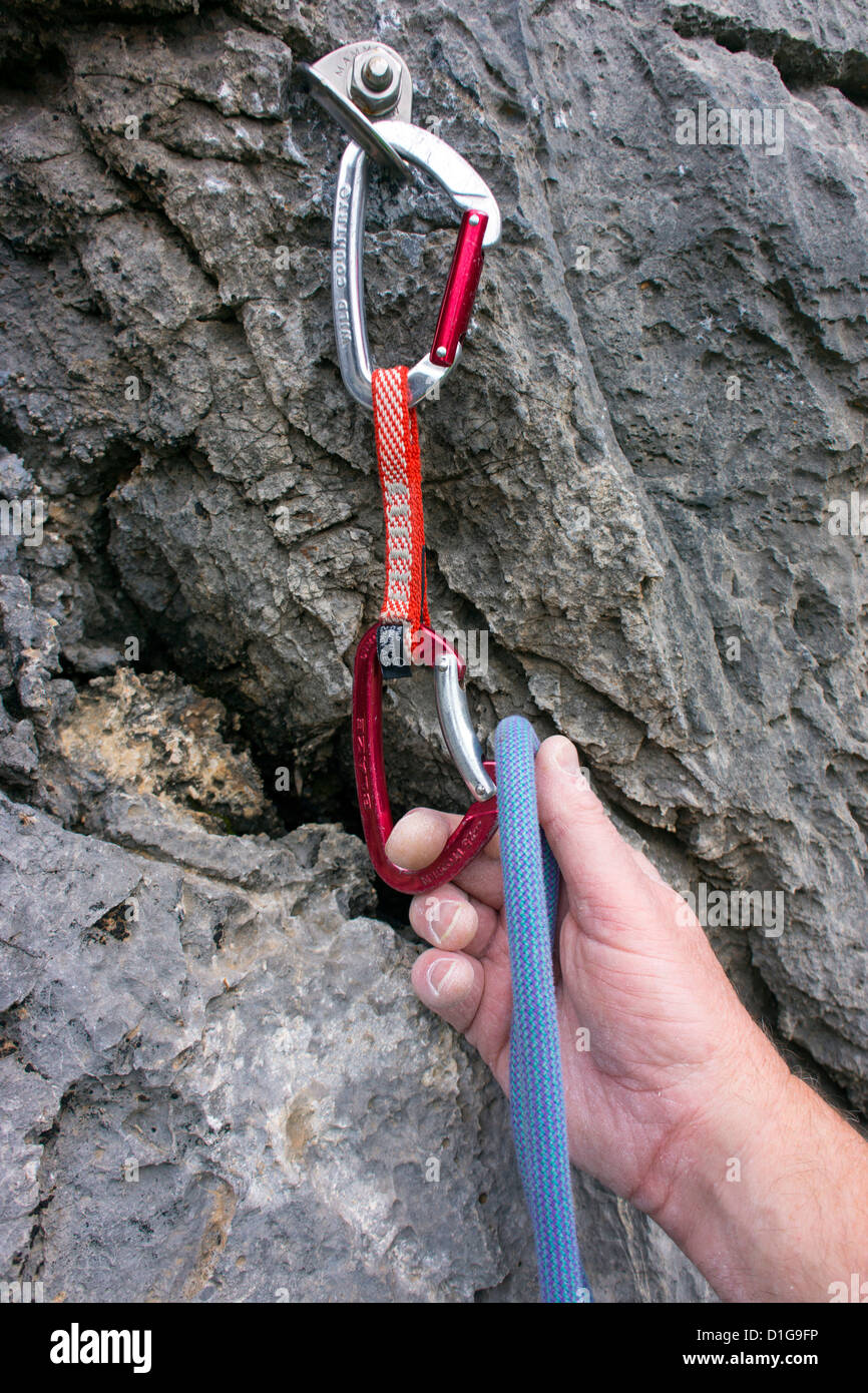rock climbing, bolt, rope, hand clipping rope in Stock Photo Alamy