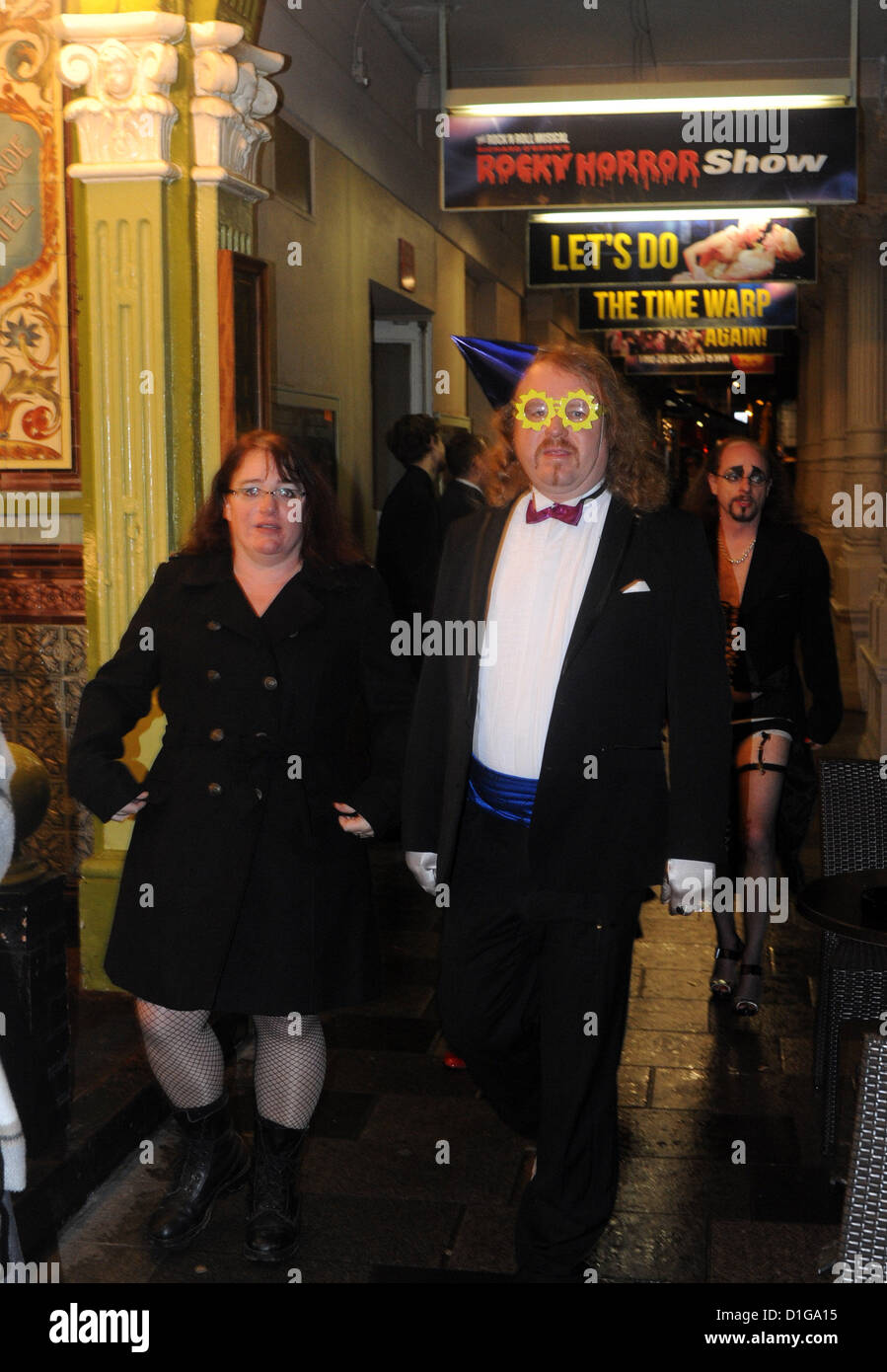 Theatre goers dressed up in traditional Rocky Horror Show outfits arrive for the first night of the UK tour at the Theatre Royal in Brighton. It is coming up for 40 years since the famous stage show was written by Richard O'Brien in 1973. Stock Photo