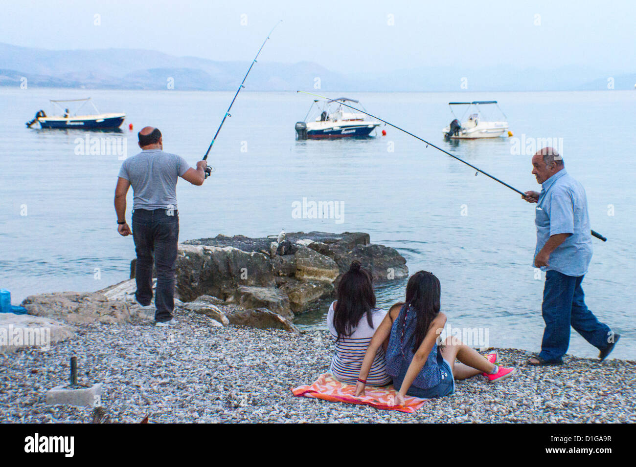 Man sitting fishing from behind hi-res stock photography and images - Alamy
