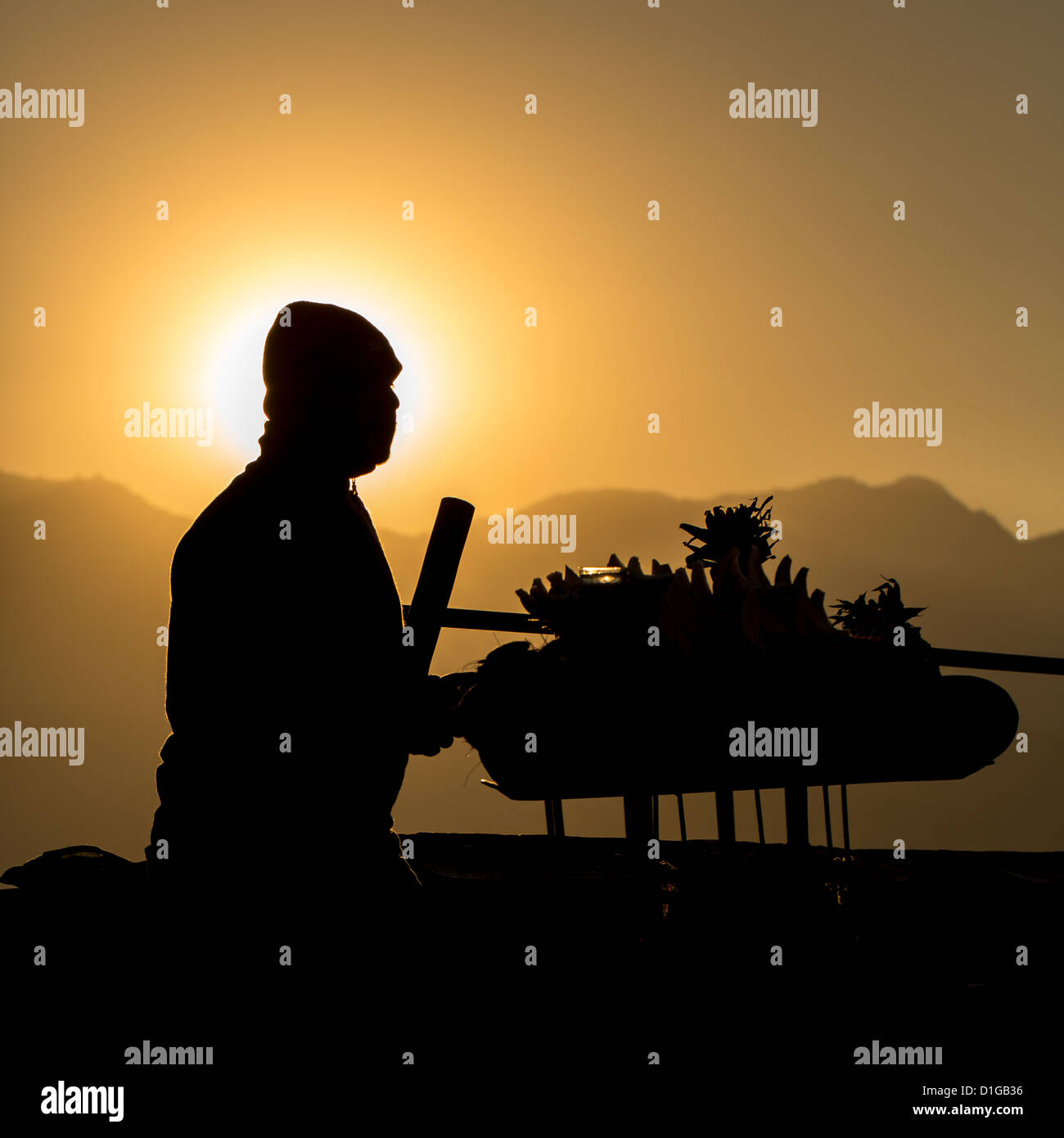 Silhouette of a man selling fruits, Kathmandu, Nepal Stock Photo