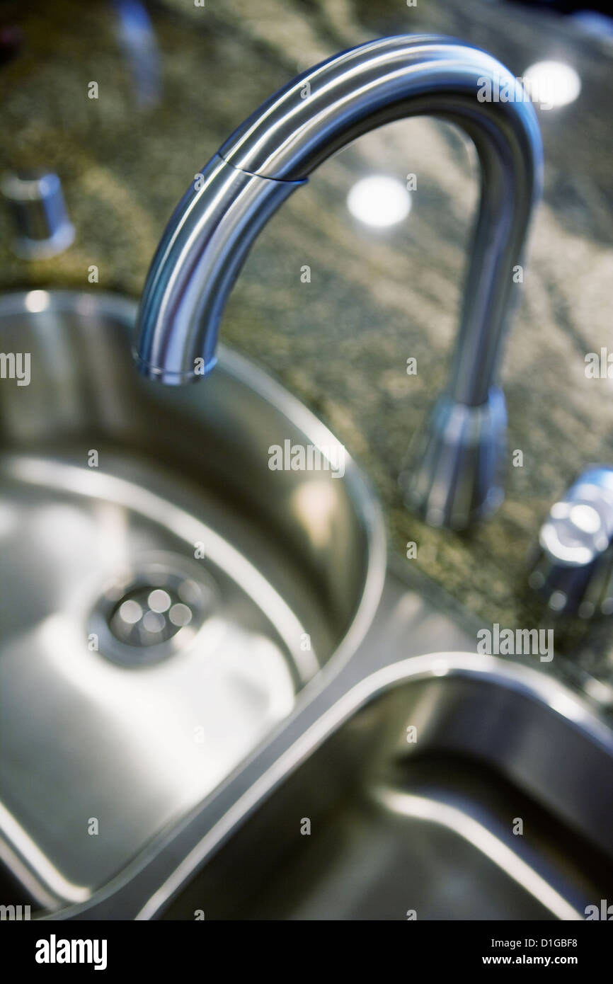 Gooseneck faucet above kitchen sink; San Diego; California; USA Stock Photo
