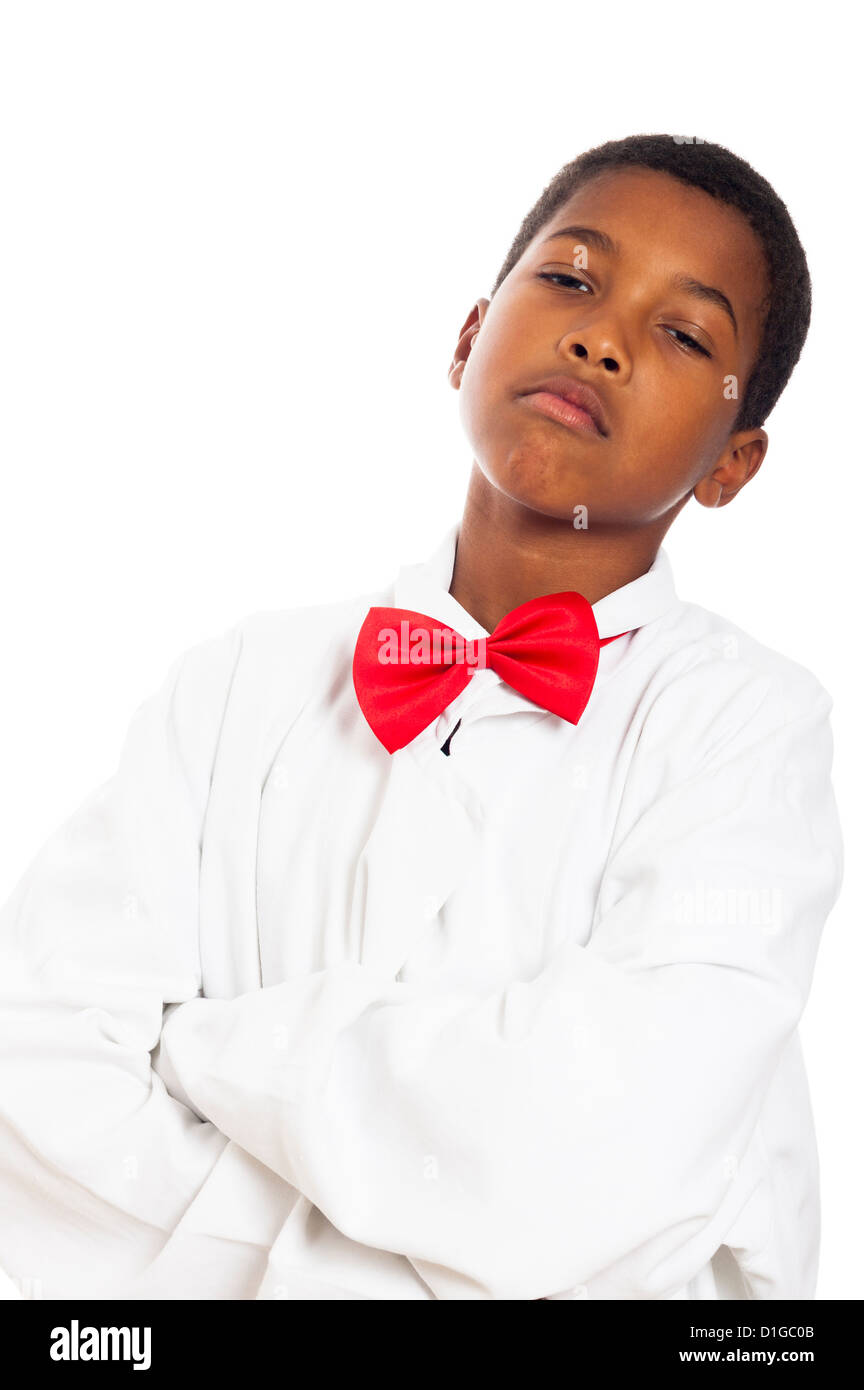 Portrait of serious child in scientist lab coat and red bow tie, isolated on white background. Stock Photo