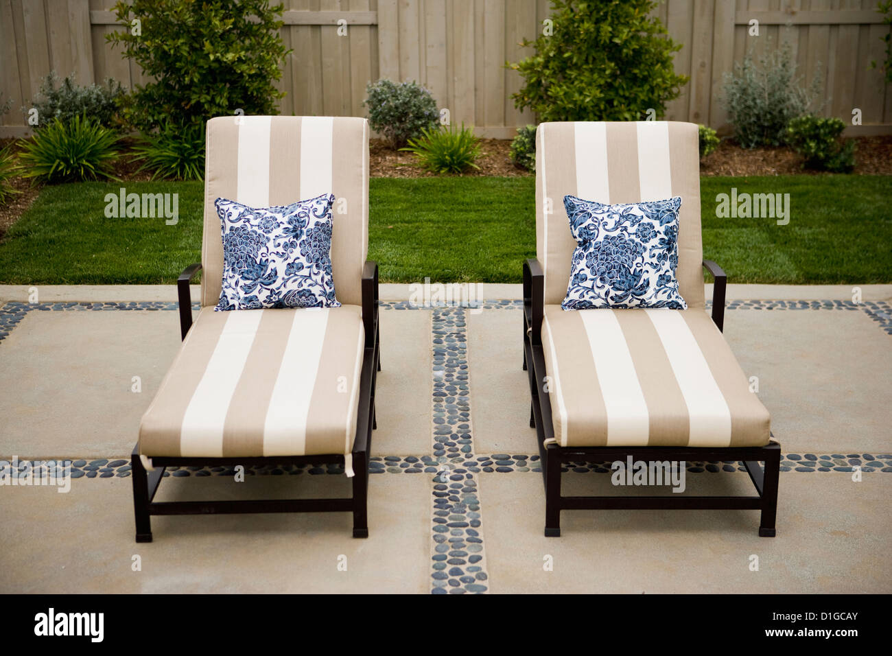 Lounge chairs with throw pillows on patio; San Diego; California; USA Stock Photo Alamy