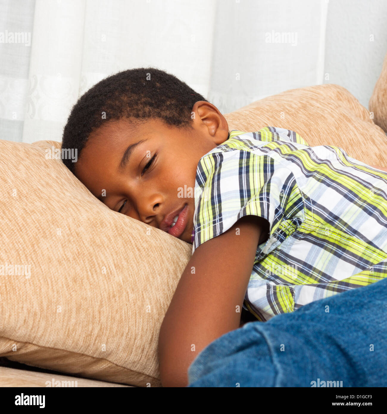 Close up of cute tired child boy sleeping on sofa Stock Photo Alamy