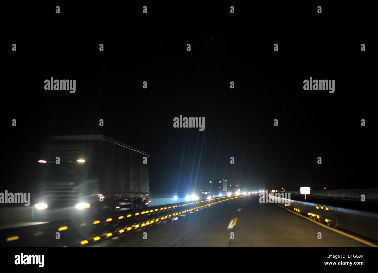 Cars are driving at night on the german Autobahn. Photo: Frank May Stock Photo