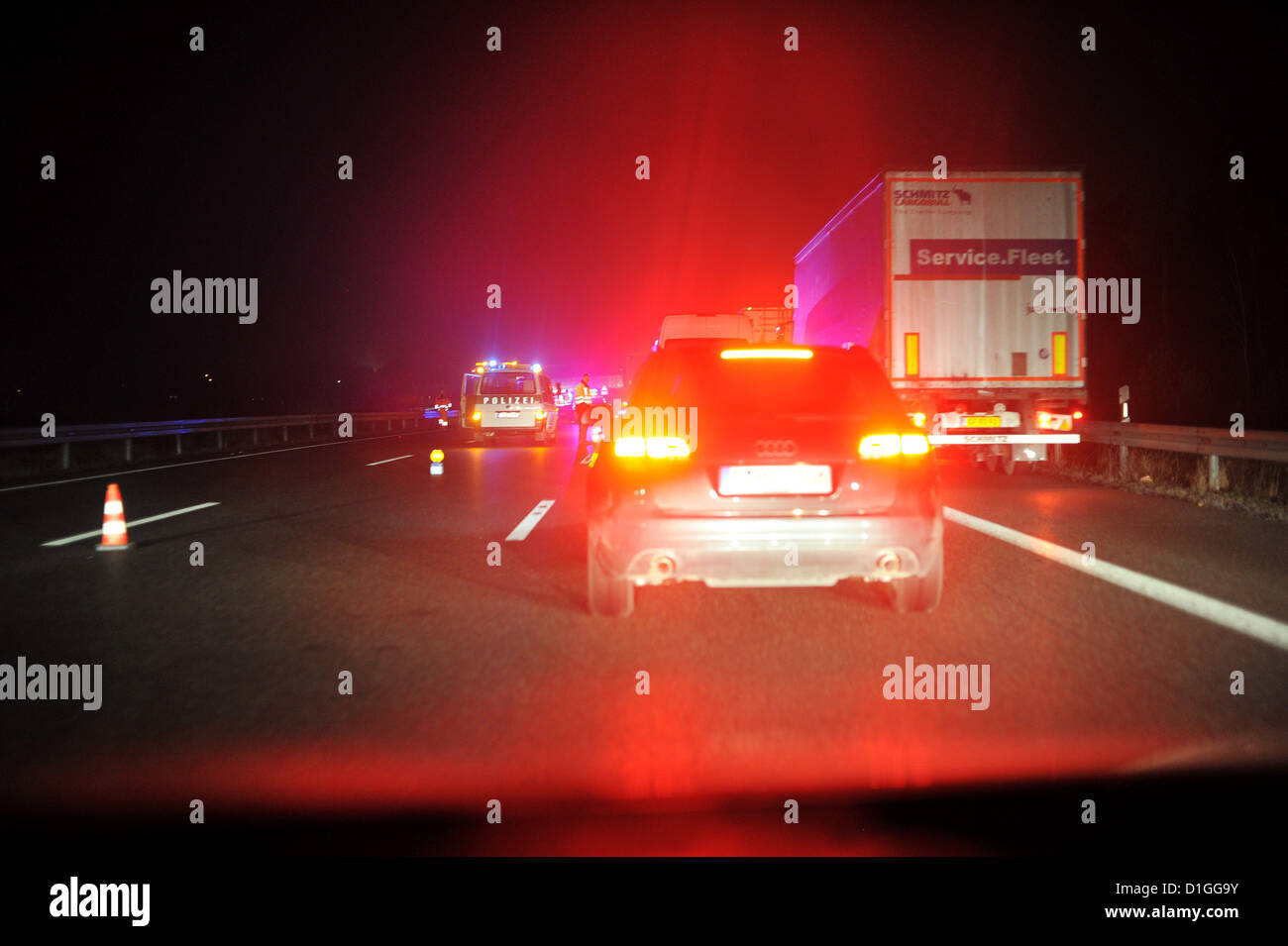 Cars are driving at night on the german Autobahn. Photo: Frank May Stock Photo
