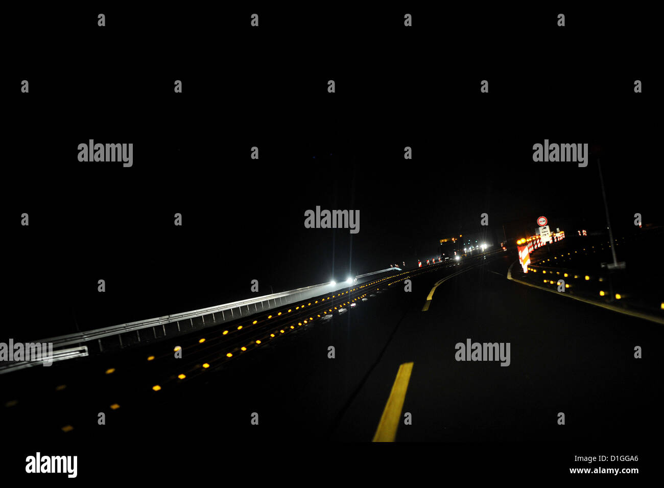 Cars are driving at night on the german Autobahn. Photo: Frank May Stock Photo