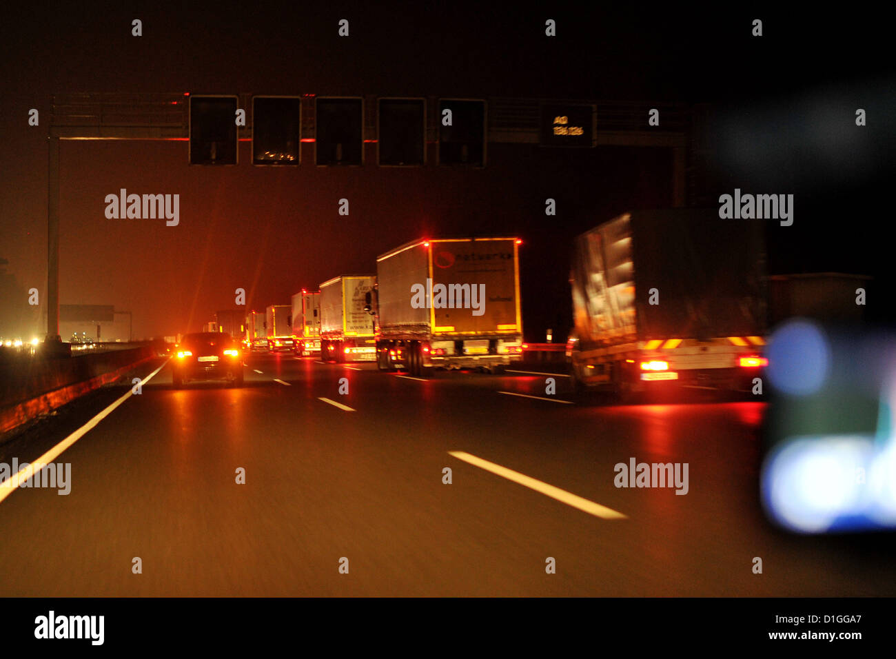 Cars are driving at night on the german Autobahn. Photo: Frank May Stock Photo