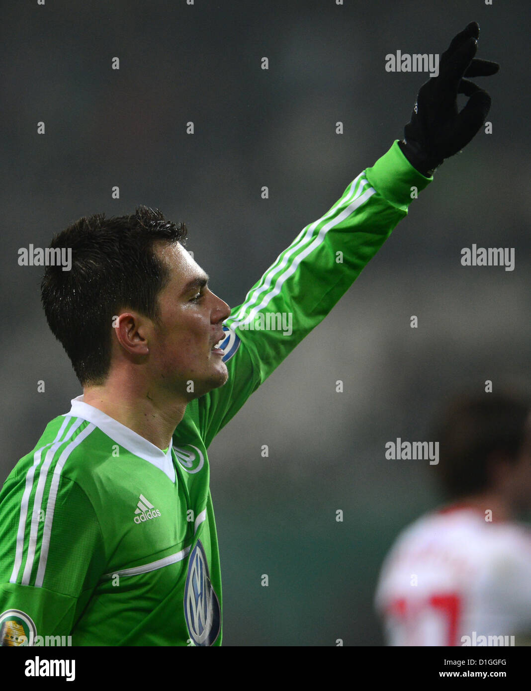 Wolfsburg's Marcel Schaefer gestures during the round of the last 16 DFB Cup match between VfL Wolfsburg and Bayer Leverkusen at Volkswagen Arena in Wolfsburg, Germany, 19 December 2012. Photo: PETER STEFFEN (ATTENTION: The DFB prohibits the utilisation and publication of sequential pictures on the internet and other online media during the match (including half-time). ATTENTION: BLOCKING PERIOD! The DFB permits the further utilisation and publication of the pictures for mobile services (especially MMS) and for DVB-H and DMB only after the end of the match.) Stock Photo