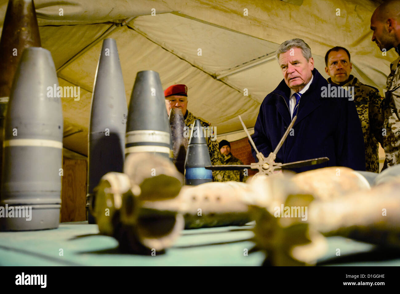 HANDOUT - A handout picture shows German President Joachim Gauck being briefed on the dangers and the removal of Improvised Explosive Devices (IED) at camp Marmal in Mazar-i-Sharif, Germany, 19 December 2012. Gauck is currently visiting soldiers of the German Armed Forces deployed at the Hindu Kush. Photo: BUNDESREGIERUNG/STEFFEN KUGLER Stock Photo