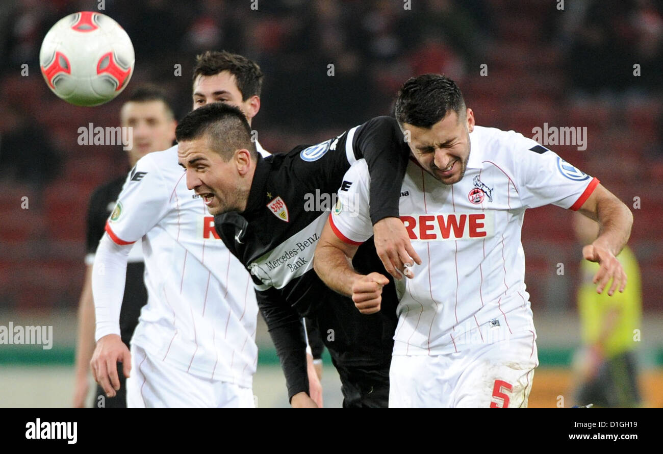 Stuttgart's SVedad Ibisevic (M) vies for the ball with Cologne's Dominic Maroh during the DFB Cup round of sixteen match between VfB Stuttgart and 1. FC Cologne at Mercedes-Benz Arena in Stuttgart, Germany, 19 December 2012. Photo: Jan-Philipp Strobel Stock Photo