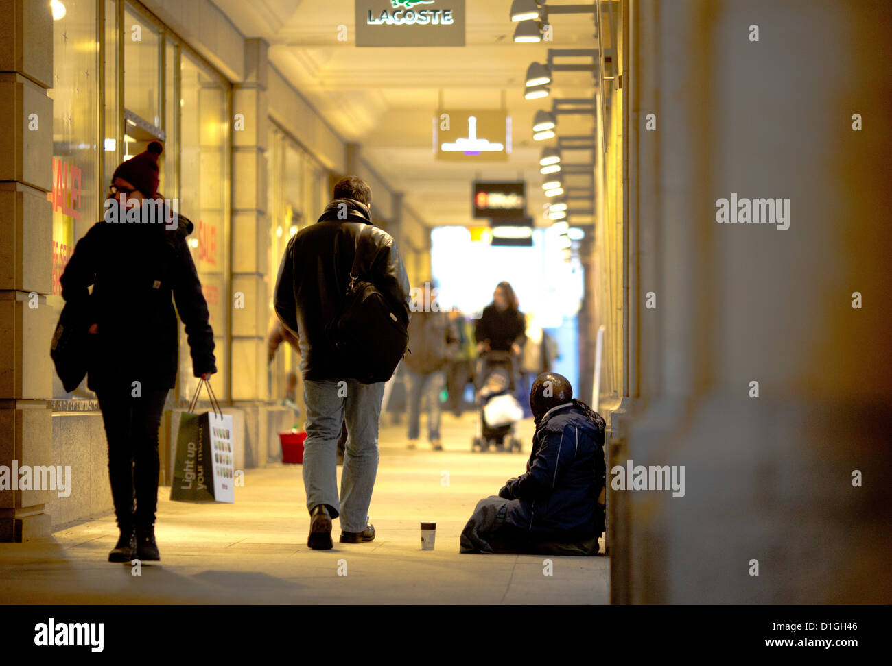 A homeless begs foe money at Friedrichstrasse station in Berlin, Germany, 20 December 2012. Photo: KAY NIETFELD Stock Photo