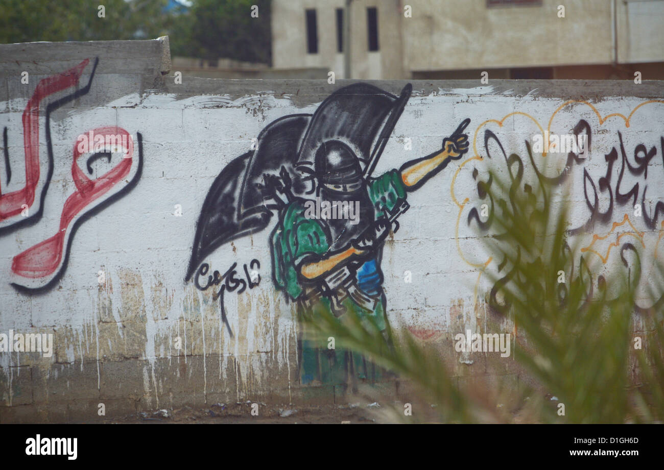 The graffiti on the wall depicts a Hamas fighter in Tel el Hawa in Gaza City, Palestinian Territories, 9 December 2012. Photo: Rainer Jensen Stock Photo