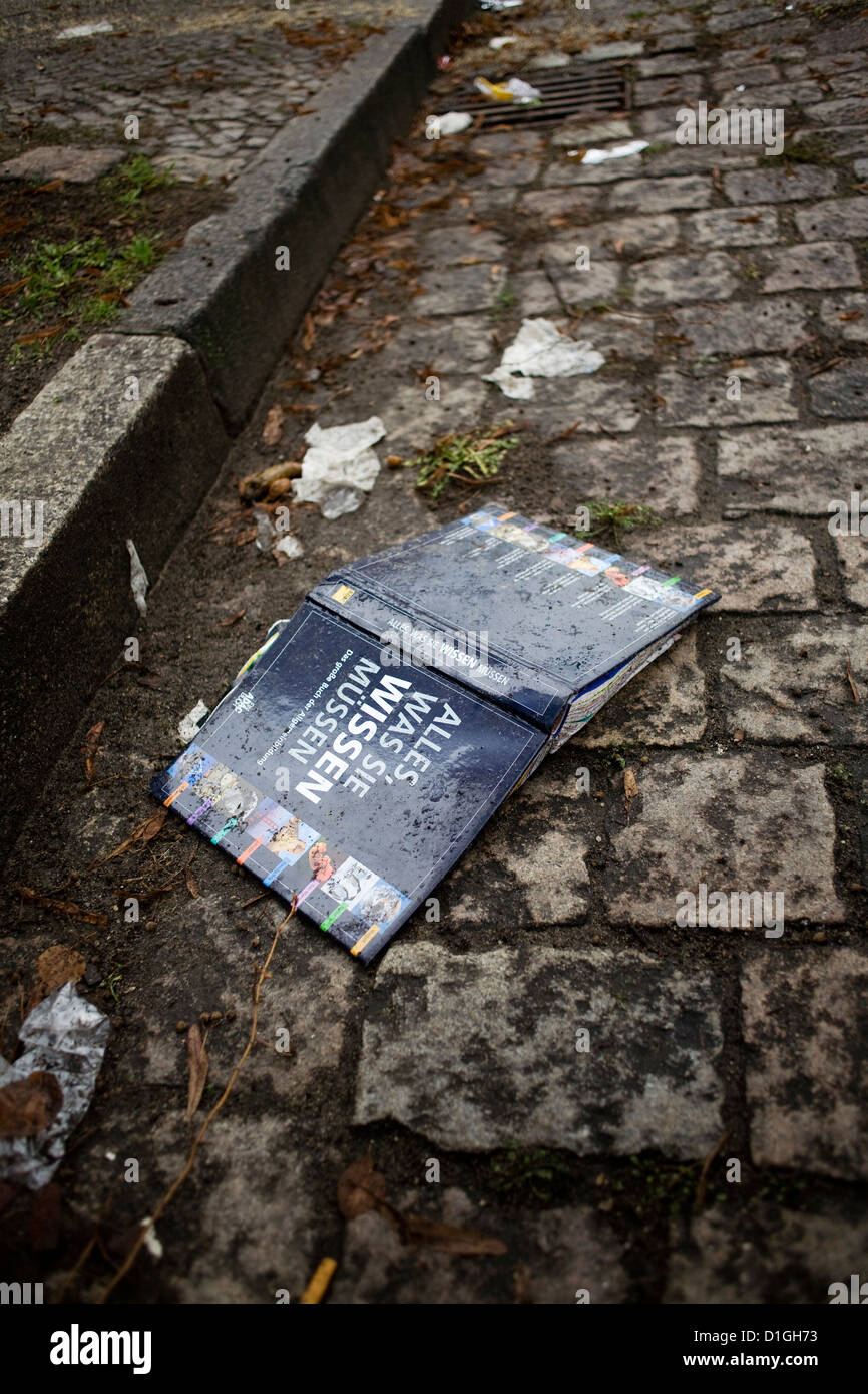 A book lies in a street in Berlin-Neukoelln, Germany, 19 December 2012. Photo: Inga Kjer Stock Photo