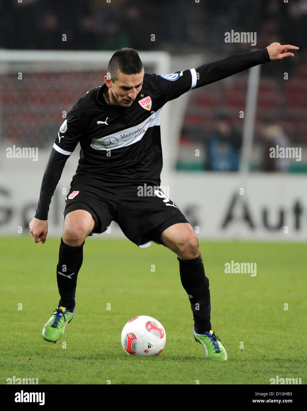 Stuttgart's Vedad Ibisevic kicks the ball during the DFB Cup round of sixteen match between VfB Stuttgart and 1st FC Koeln at the Mercedes-Benz Arena in Stuttgart, Germany, 19 December 2012. Photo: Jan-Philipp Strobel Stock Photo