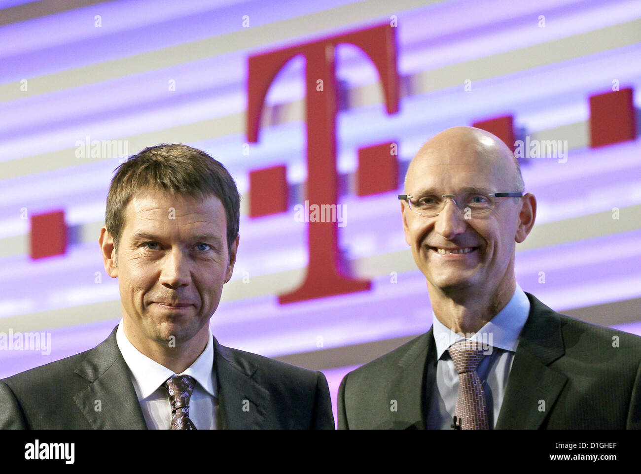 Chief Executive Officer of Deutsche Telekom, Rene Obermann, (L) and finance director Timotheus Hoettges are featured in Bonn, Germany, 05 August 2010. The Deutsche Telekom released her figures for first mid-year 2010. Photo: Oliver Berg Stock Photo