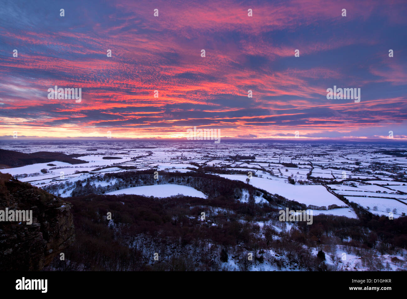Fiery sunset over a snow covered Gormire Lake, North Yorkshire, Yorkshire, England, United Kingdom, Europe Stock Photo