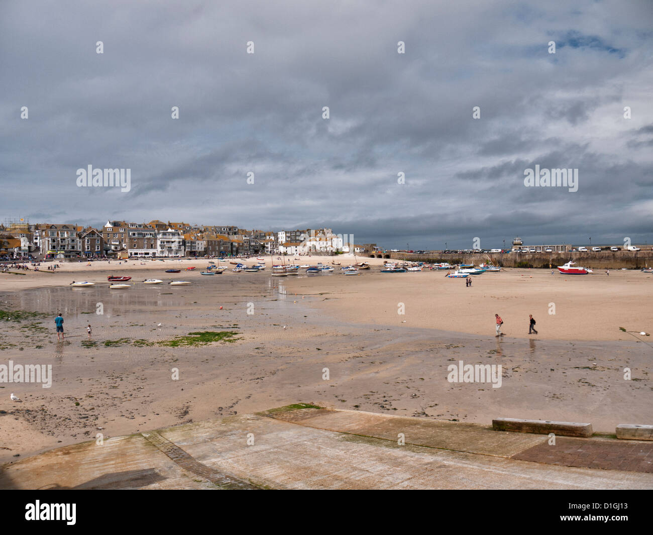 The tide is out in St Ives Harbour at the Southern end of Cornwall in the South West of England United Kingdom Stock Photo