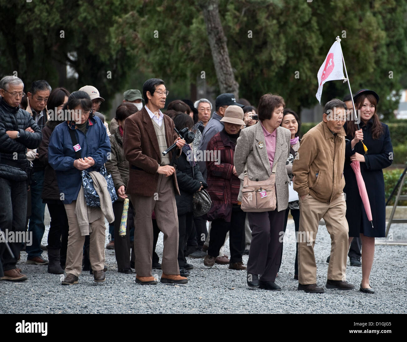 Kyoto, Japan. A tour guide leads a tourist group visiting Tofukuji