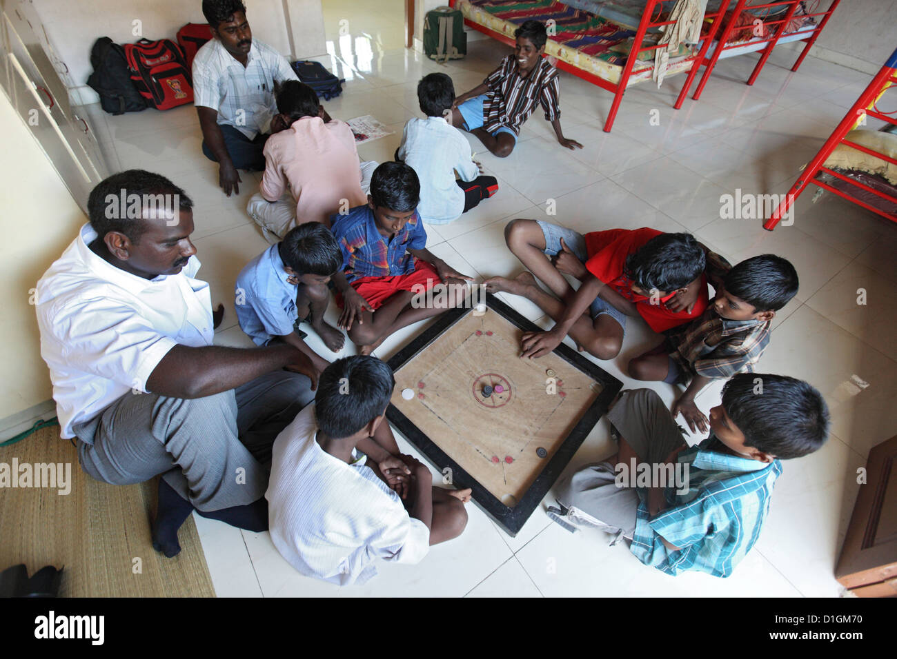 Chennai, India, boys at the orphanage playing the board game of carrom Stock Photo Alamy