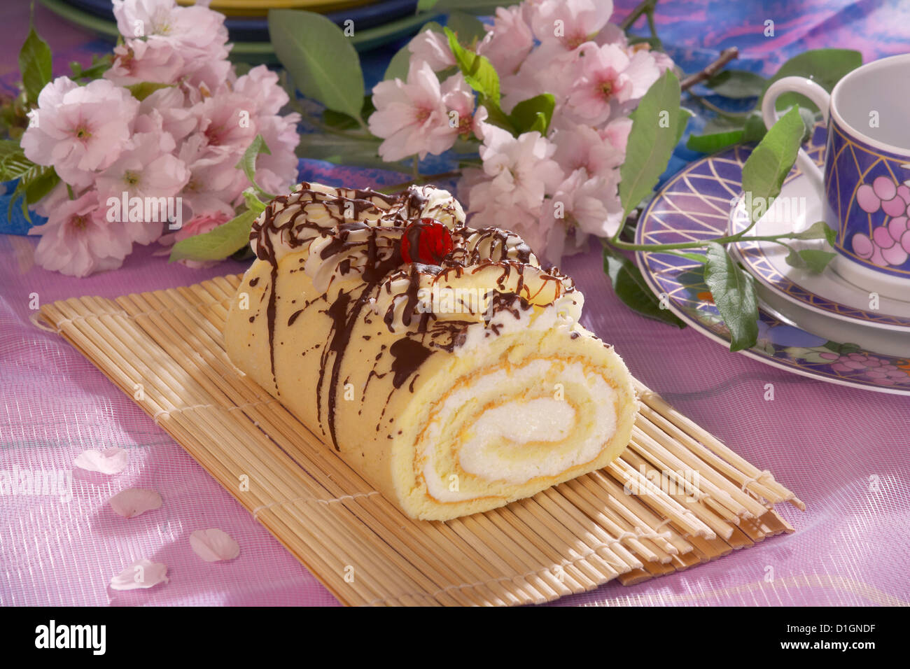 Rolled Vanilla Cake with chocolate glaze Stock Photo