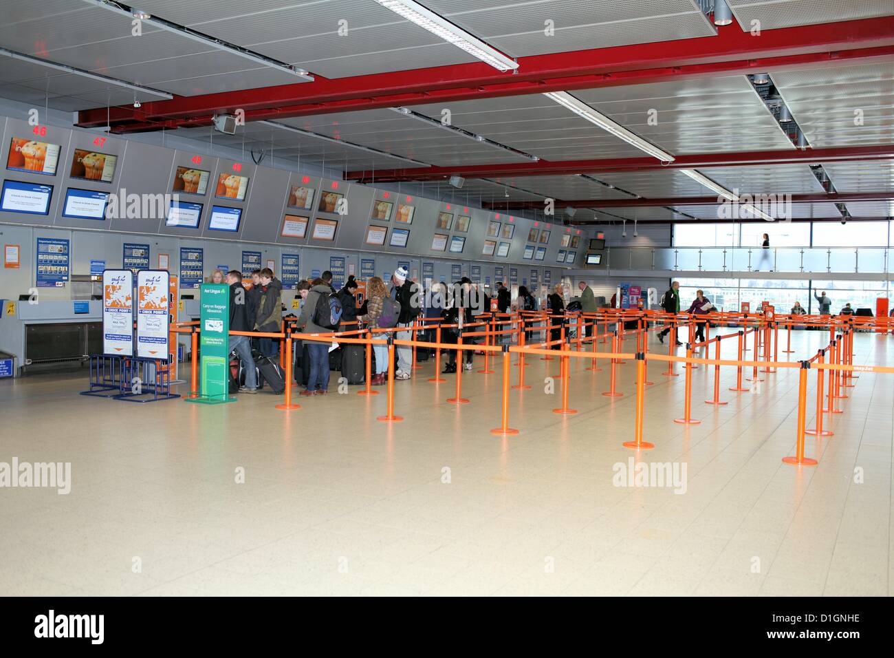 Queues for check-in are very short, with no delays experienced by passengers at Luton Airport Stock Photo