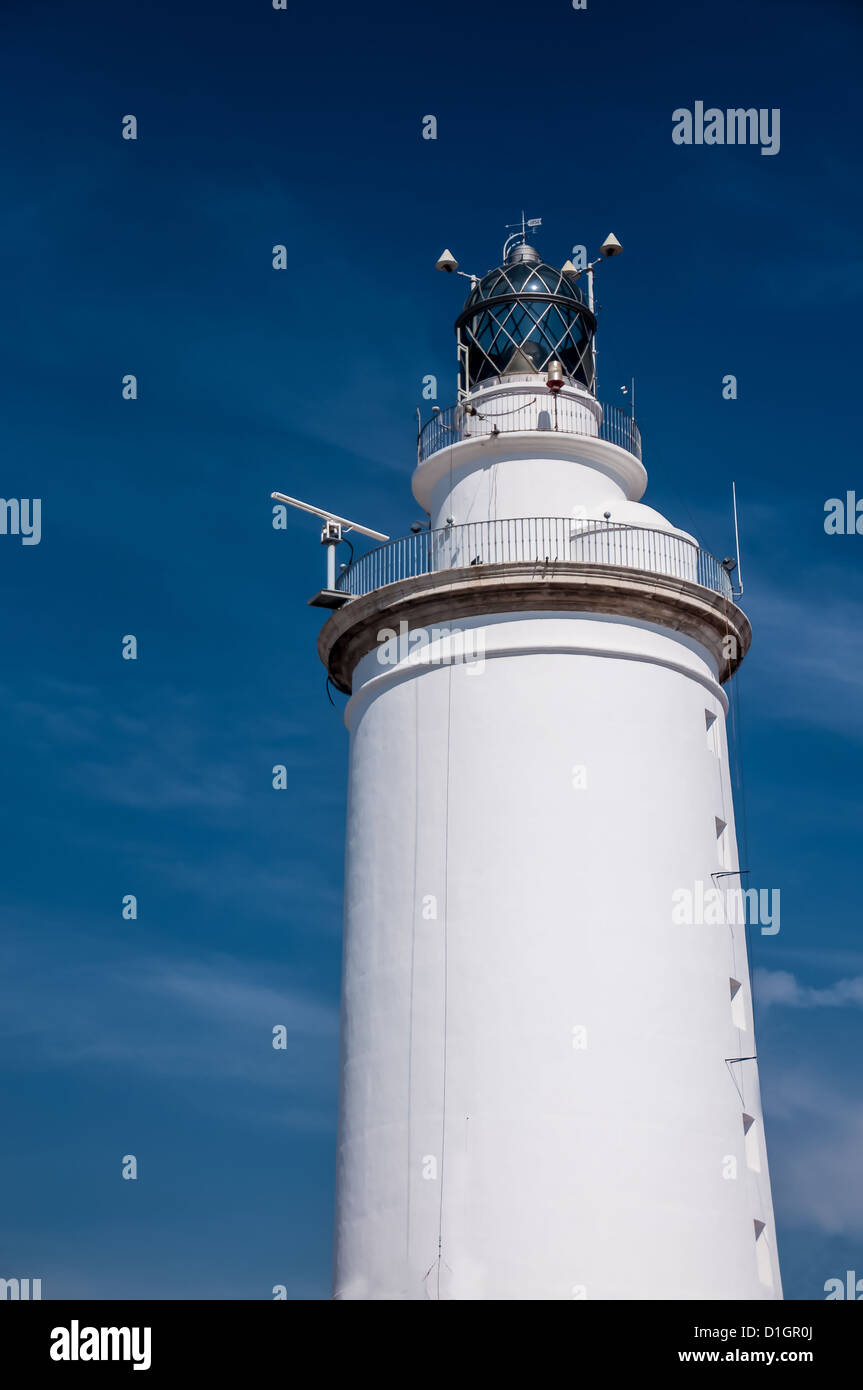 A white lighthouse in Malaga harbour Stock Photo