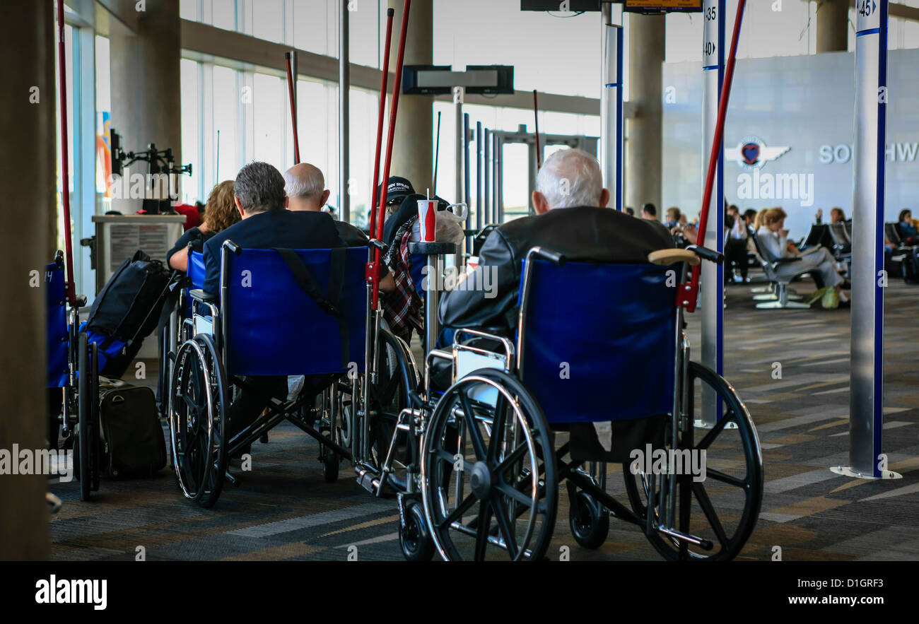 Preboarding customers in wheelchairs wait at the gate in Houston Tx