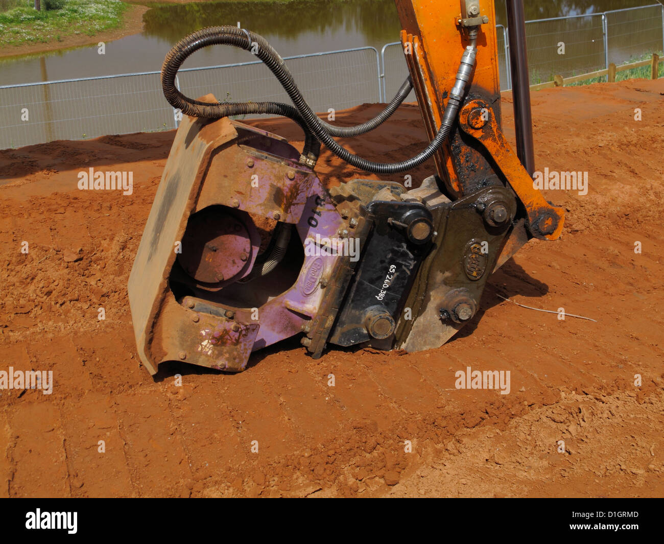 Excavator mounted hydraulic vibrating plate compacter compacting ...