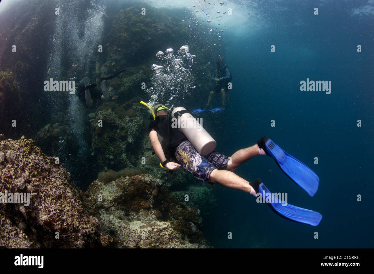 Divers going into the Chimney at Sail Rock, Koh Tao, Thailand
