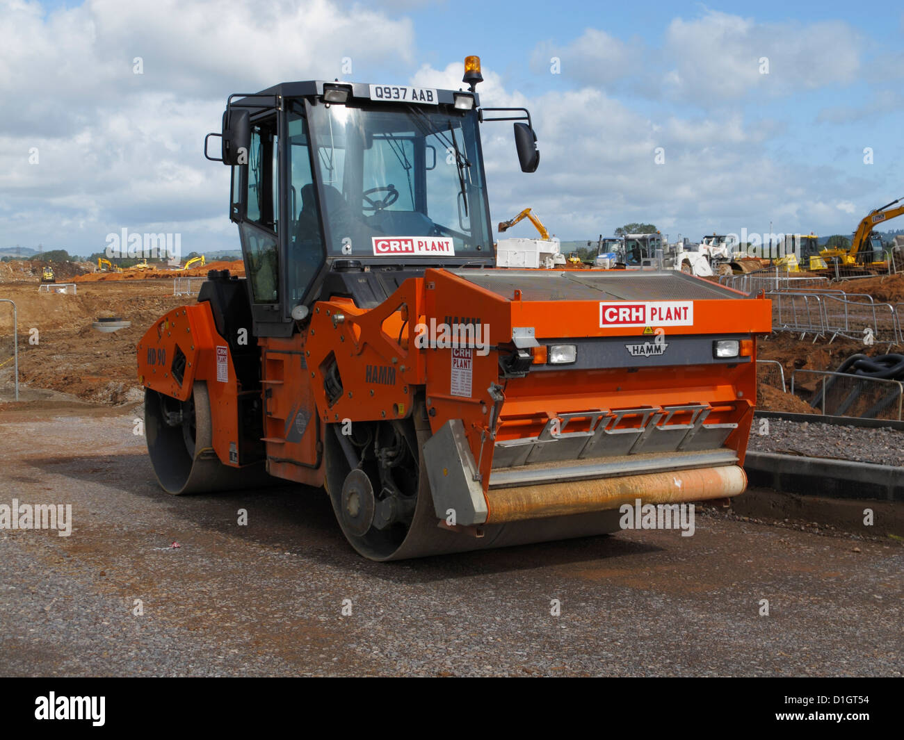 Tandem vibrating roller with hopper for gritting freshly laid SMA