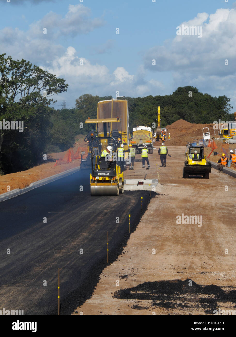 Laying asphalt tarmac blacktop surface surfacing new road ...