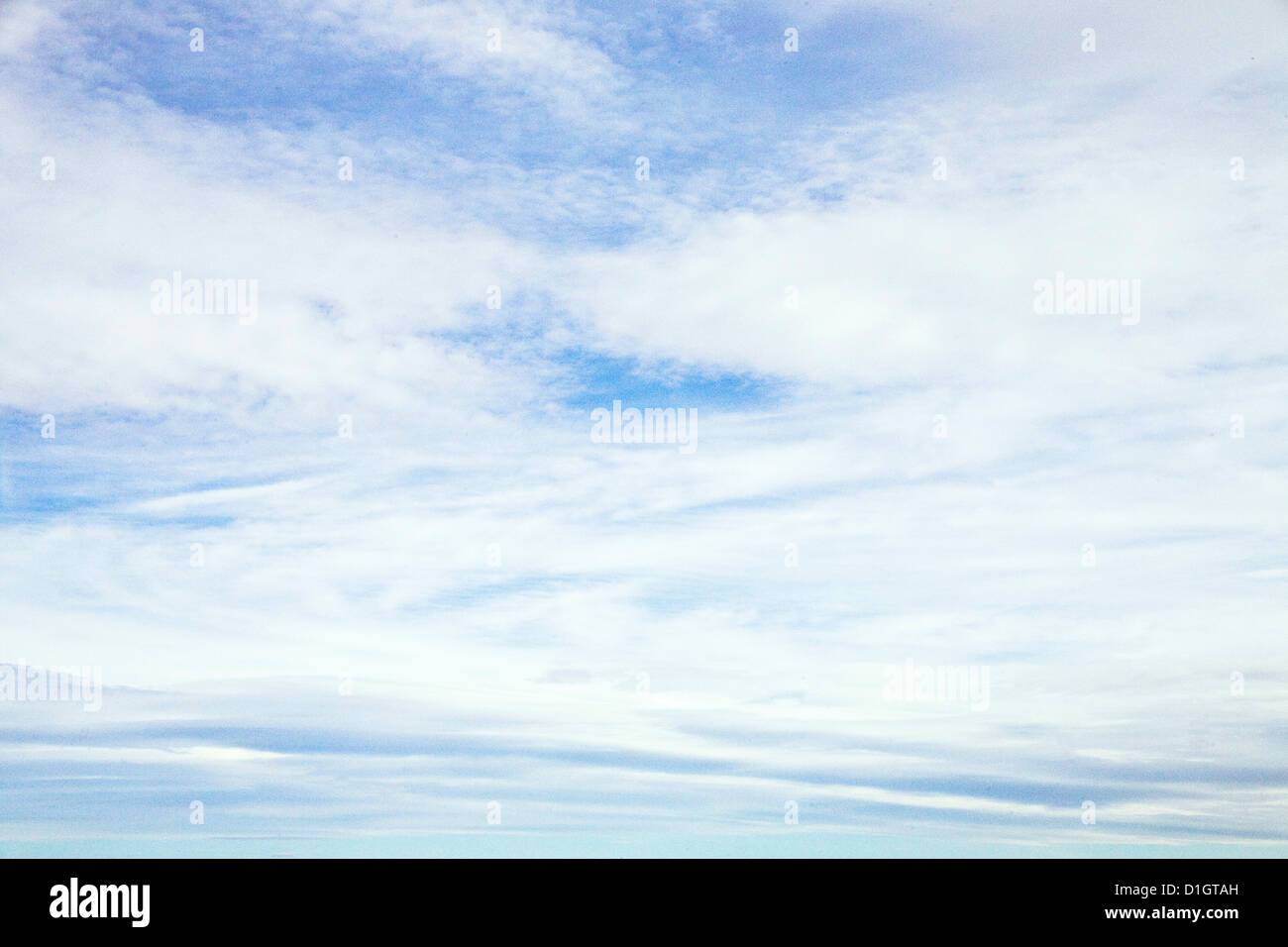whispy white clouds in motion, blue sky Stock Photo