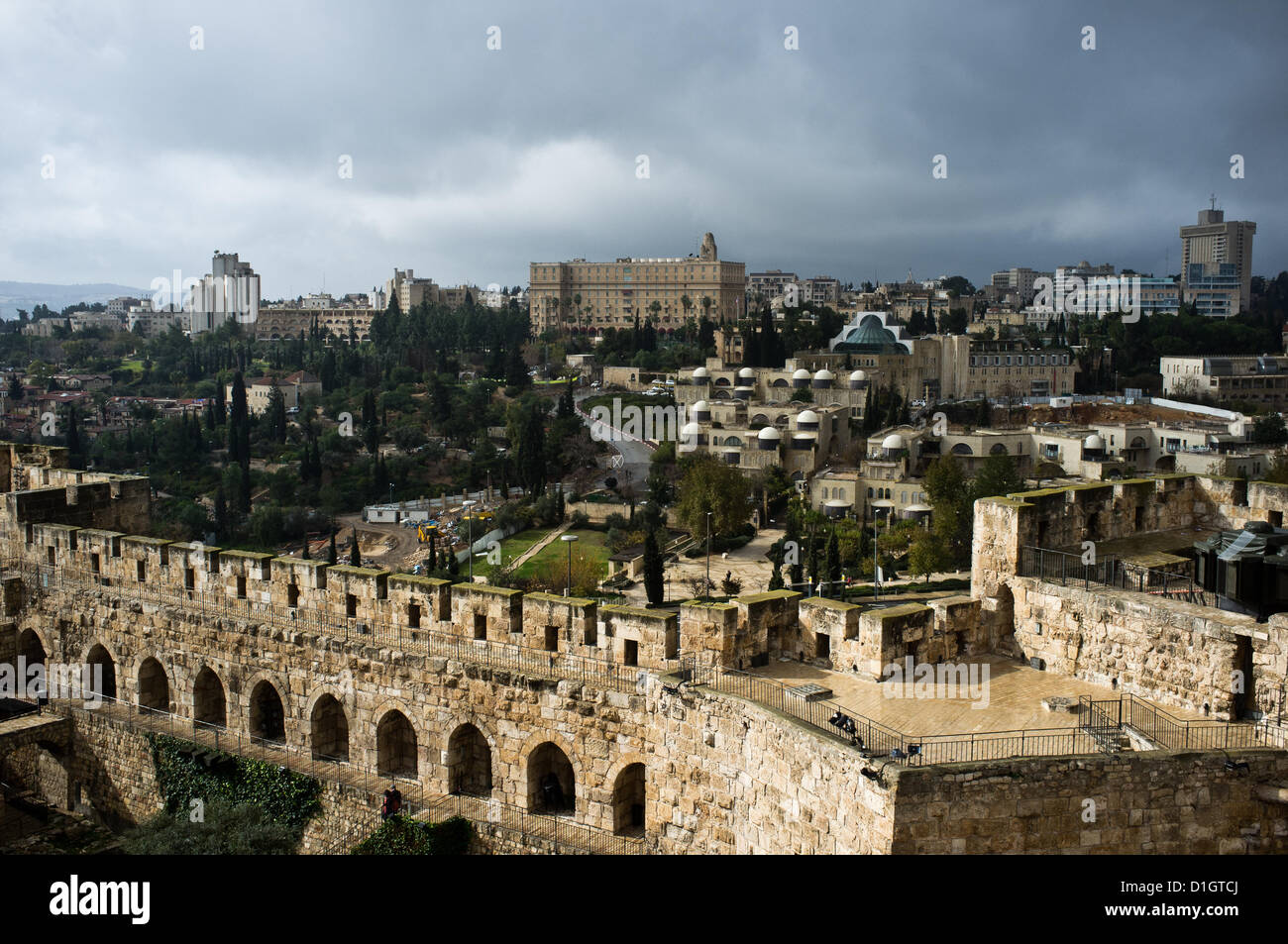 A view to the west from the Phasael Tower Observatory on a rainy Winter Solstice morning shows the modern western city in the background with the King David Hotel in the center. Jerusalem, Israel. 21-Dec-2012. A cold, windy and rainy Winter Solstice morning at the Jaffa Gate as locals and tourists seek refuge from the rain rather than Armageddon at end of the Mayan Calendar. Stock Photo