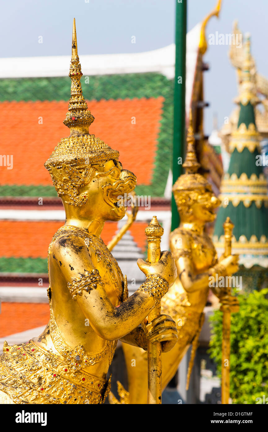 Two gold guardian statues, at the Grand Palace, Bangkok, Thailand, Southeast Asia, Asia Stock Photo