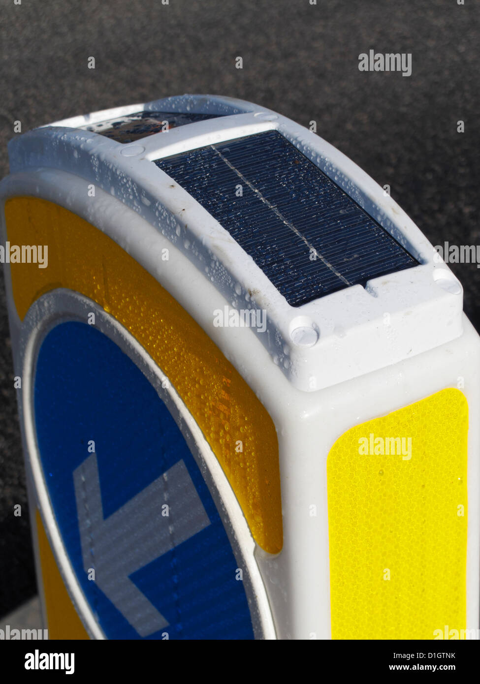 photoelectric photovoltaic cell on top of a solar powered keep left bollard UK Stock Photo