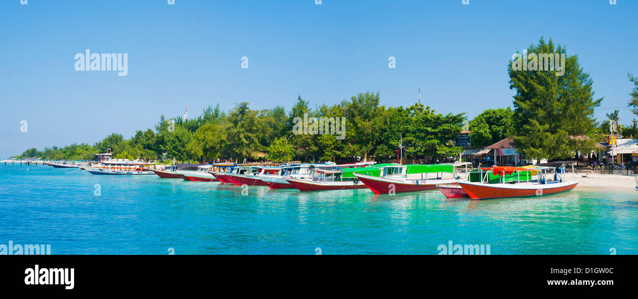 Gili Trawangan harbour, traditional boats on the crystal clear ocean at Gili Trawangan, Gili Islands, Indonesia, Southeast Asia Stock Photo