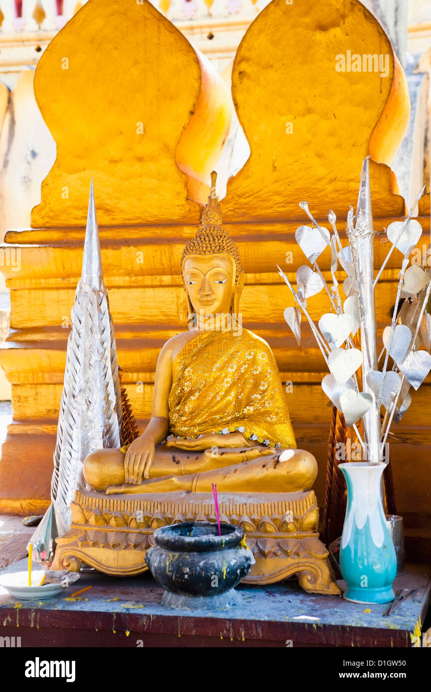 Bright gold Buddha statue at Pha That Luang, a Buddhist templ, Vientiane, Laos, Indochina