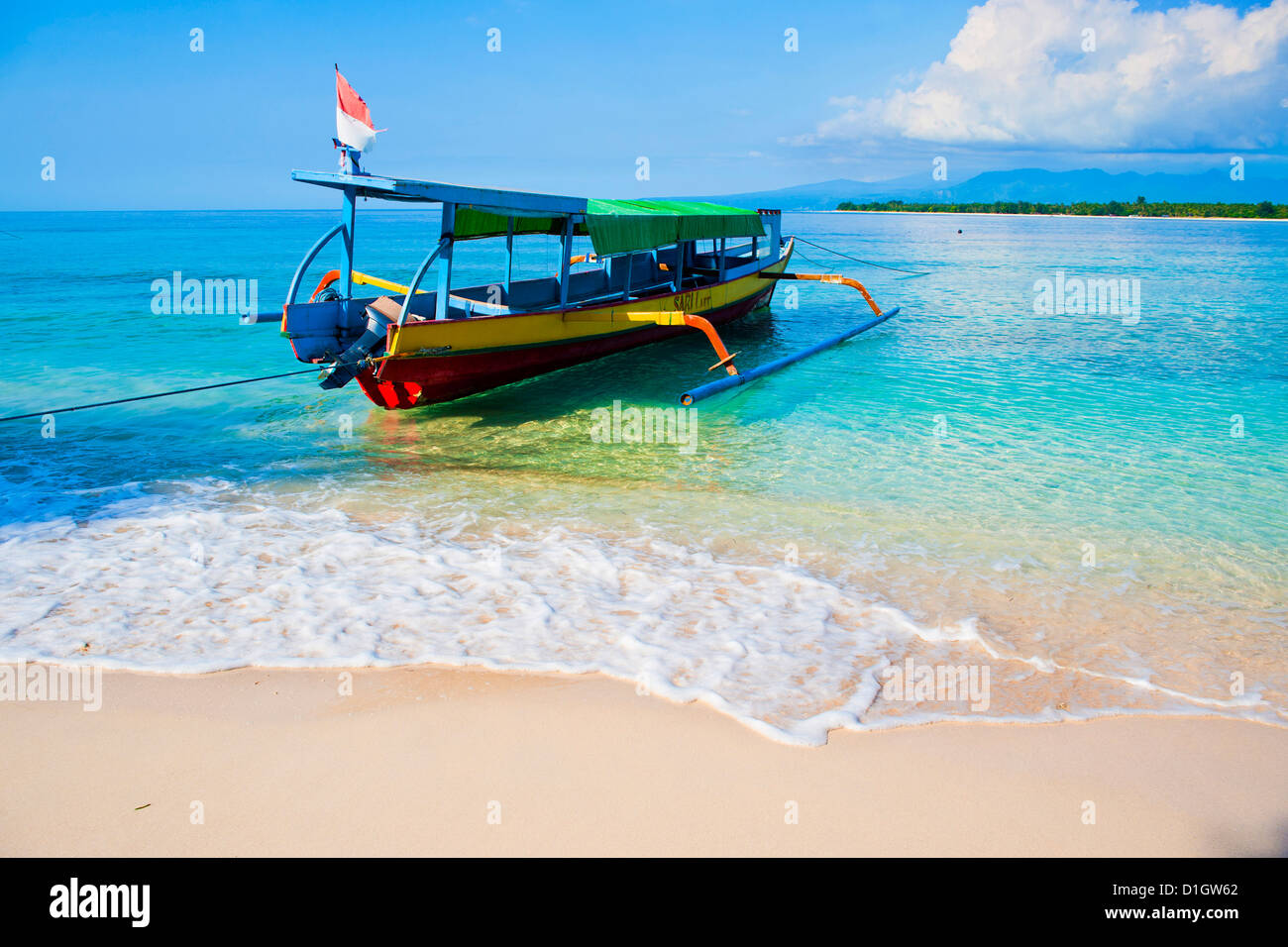 Traditional Indonesian outrigger fishing boat on the island of Gili Meno in the Gili Isles, Indonesia, Southeast Asia, Asia Stock Photo