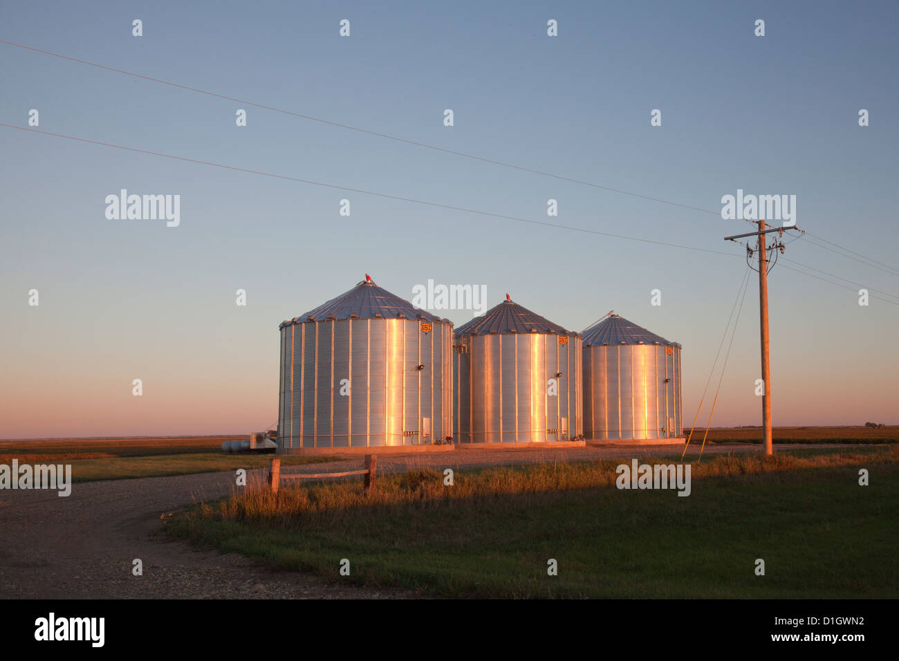 Grain silos east of Redfield, South Dakota, in evening light. Stock Photo