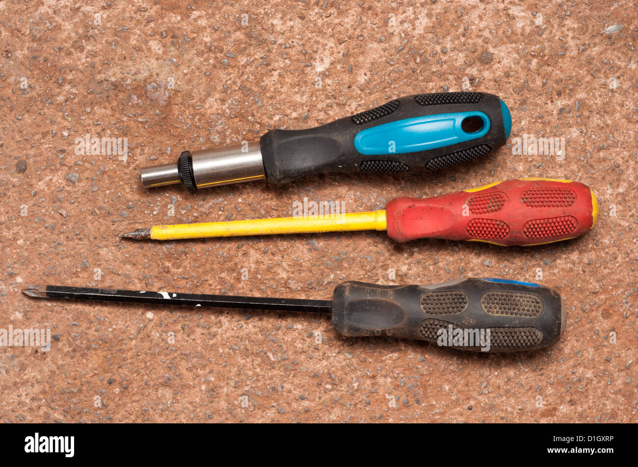 Hand tools old screwdrivers and newer adjustable screwdriver. Stock Photo