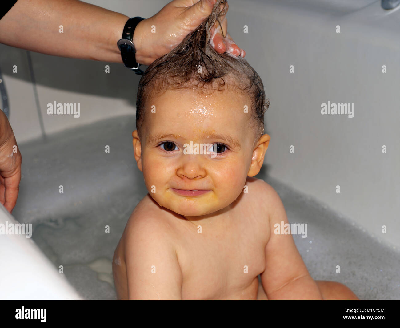 Eighteen Month Old Baby Girl In Bath With Soap In Her Hair Stock Photo 