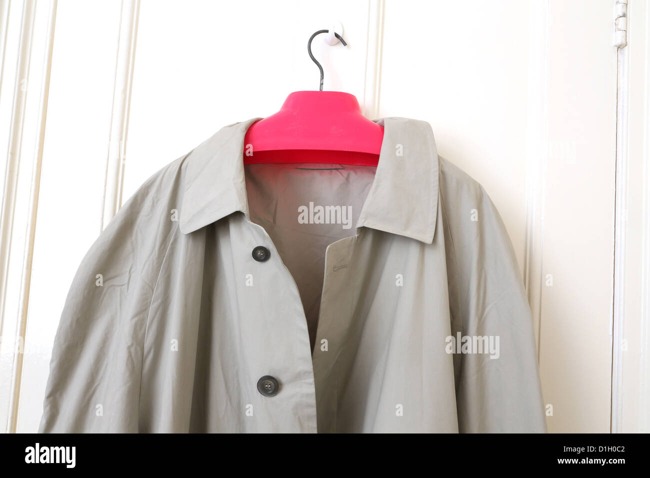 Close Up Of Raincoat Hanging On A Door Stock Photo - Alamy