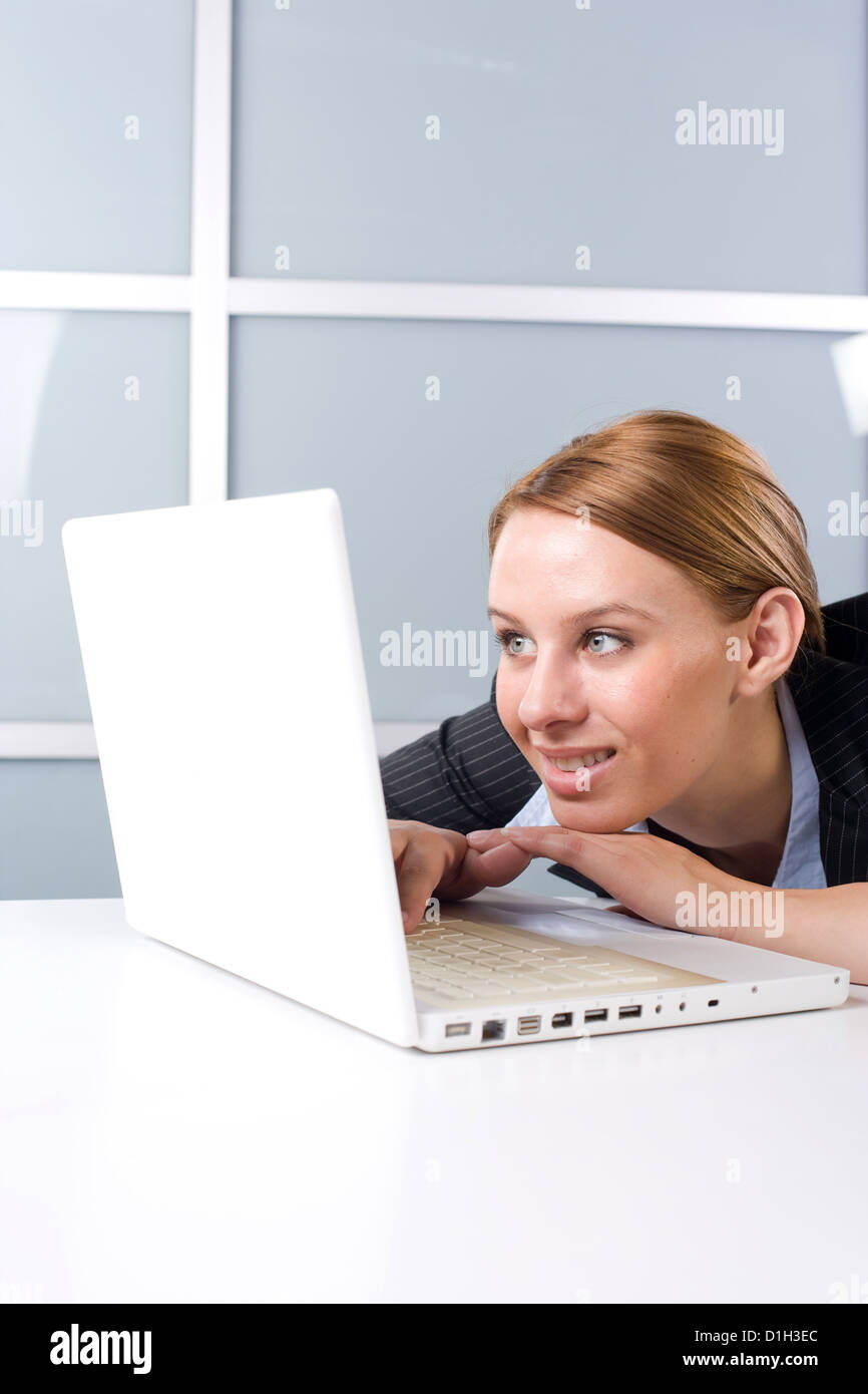 Business woman laptop in modern office Stock Photo - Alamy