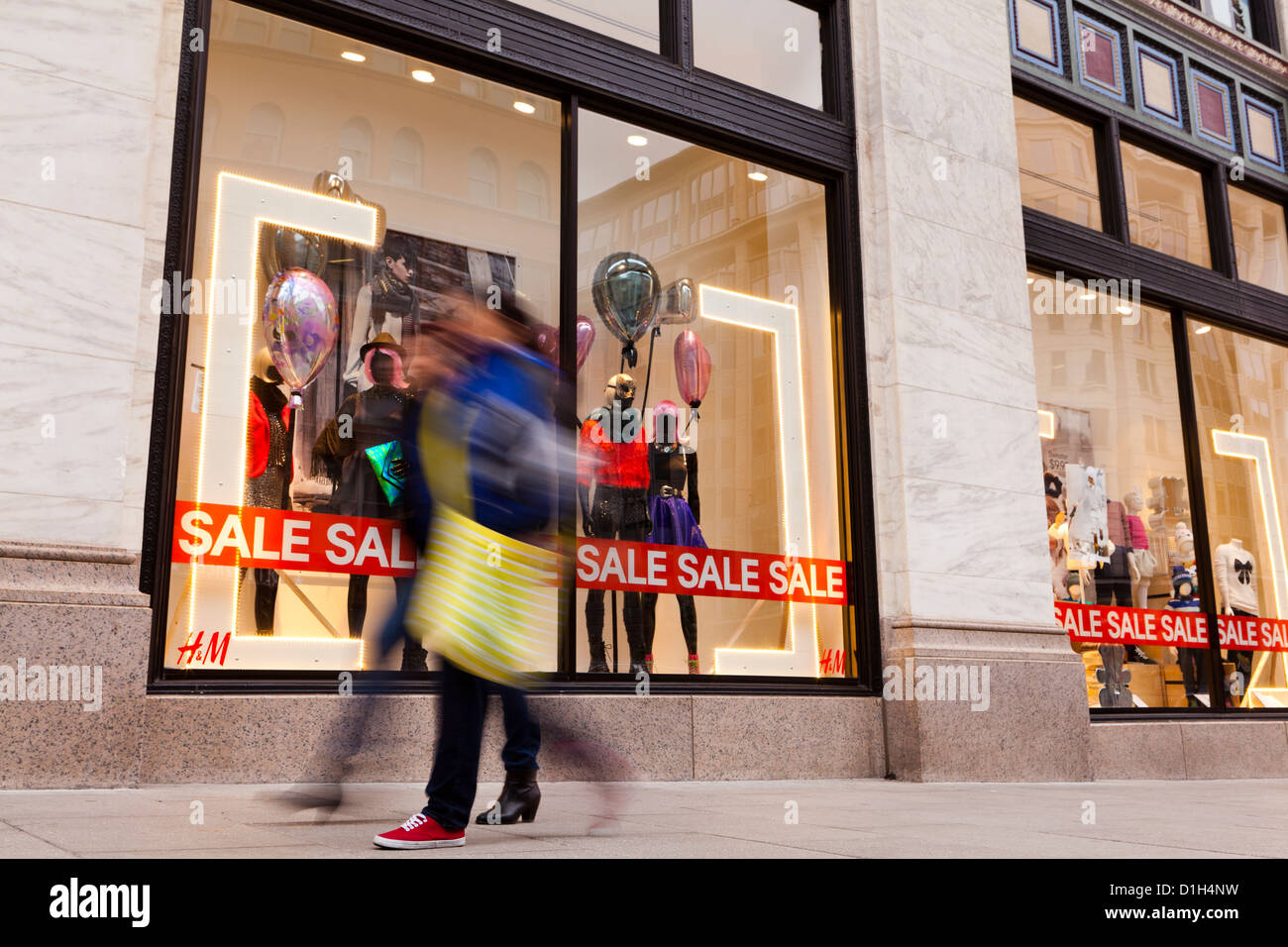 People walking by H&M clothing store window display - Washington, DC USA  Stock Photo - Alamy