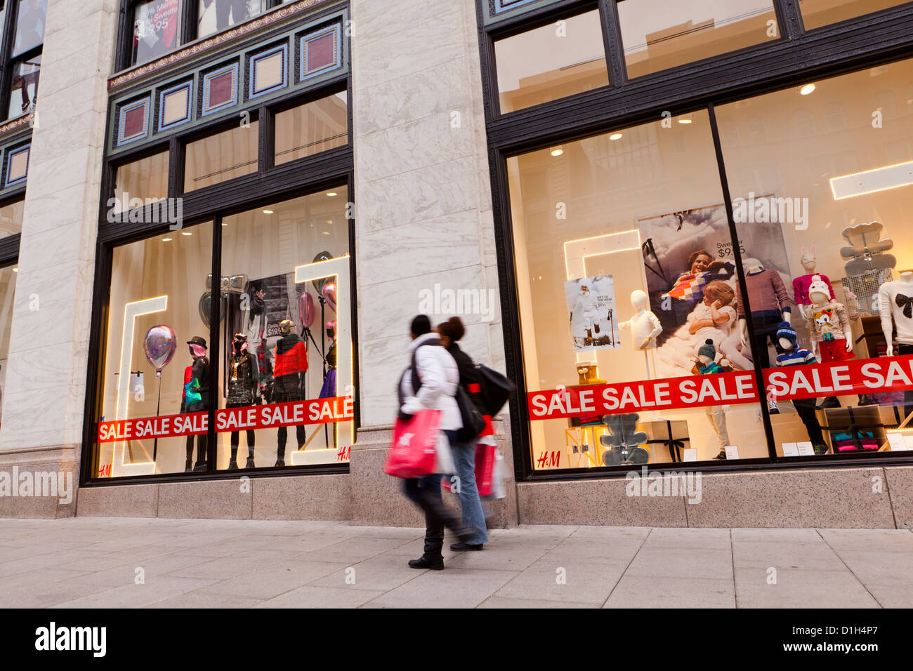 People walking by H&M clothing store window display - Washington, DC USA  Stock Photo - Alamy