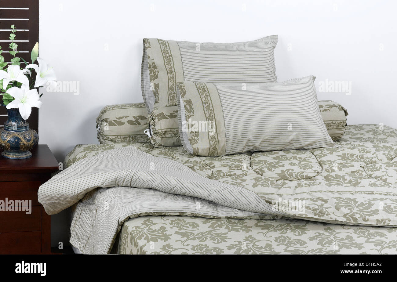 Beautiful mattress and accessory on the set up bedroom Stock Photo